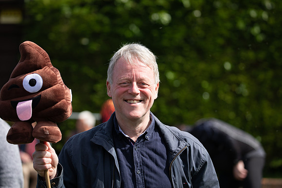 Activist holds emoji poo cuddly toy